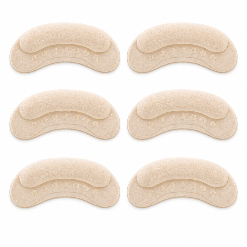 Set of six beige shoe inserts on a white background الصورة الرئيسية