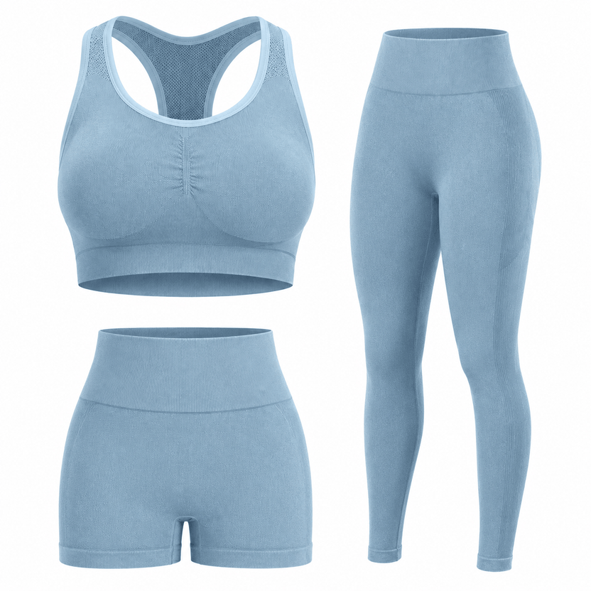 Light blue athletic outfit with sports bra, leggings, and shorts on a white background الصورة الرئيسية