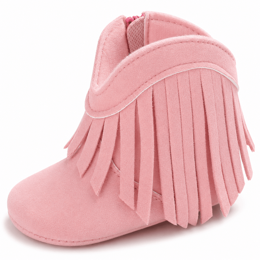 Pink fringed baby bootie on a white background الصورة الرئيسية