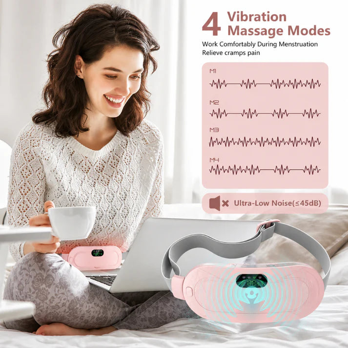 Woman using a vibration massage device with laptop and cup, showing 4 vibration massage modes. الصورة الرئيسية
