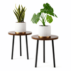 Two small round tables with planters on a white background